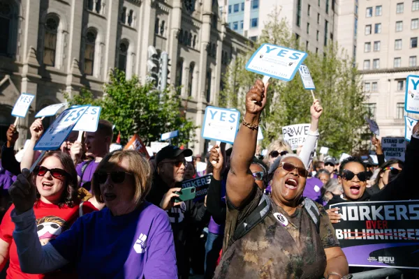 Union workers cheering at May Day 2026