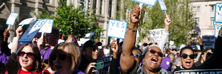Union workers cheering at May Day 2026