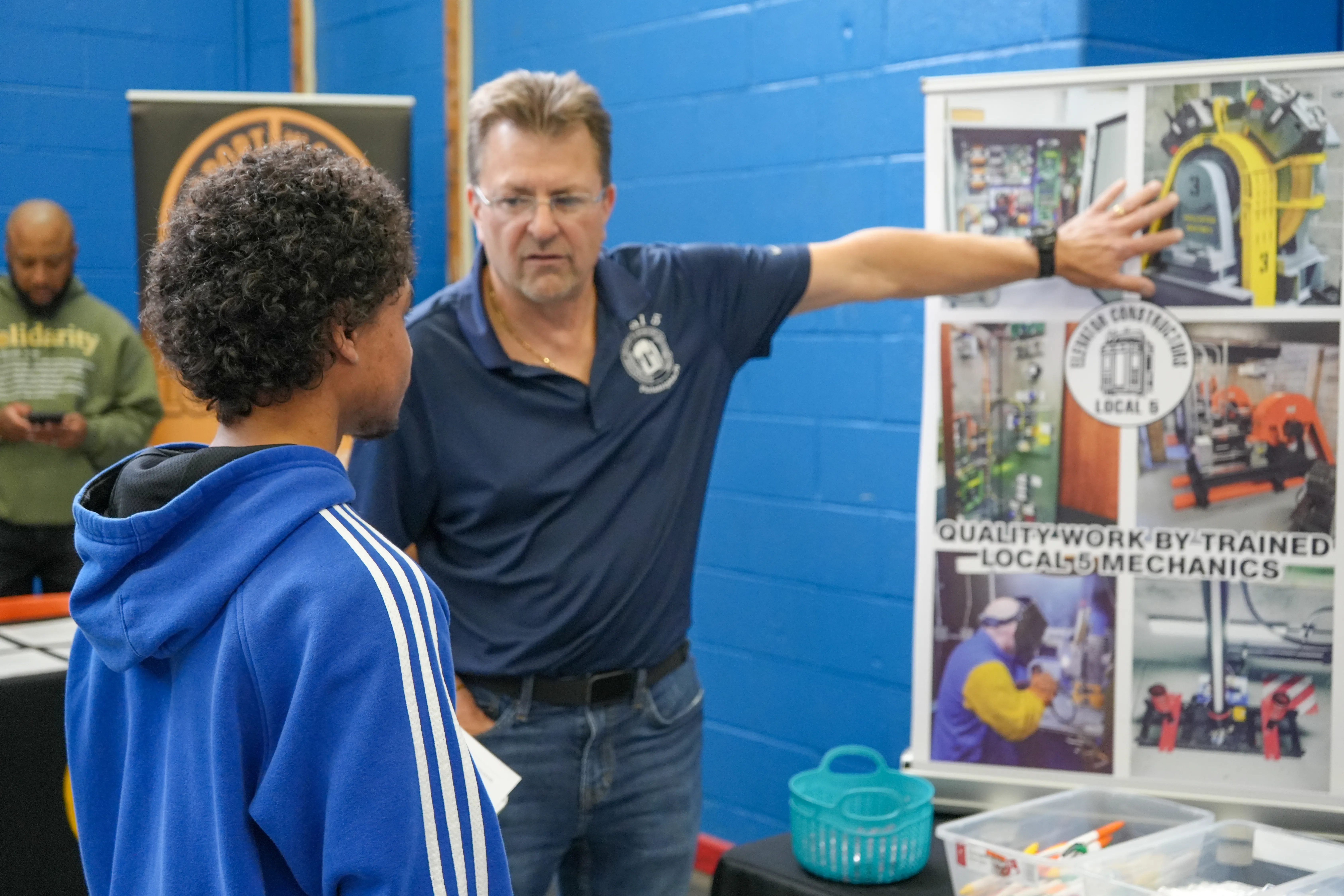 Student talking to a rep from Bricklayers local 1