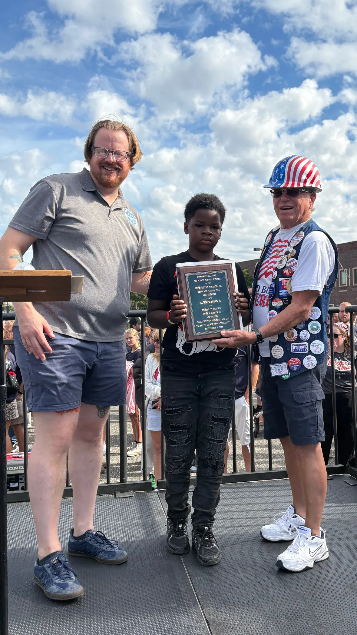 Student being awarded a plaque 