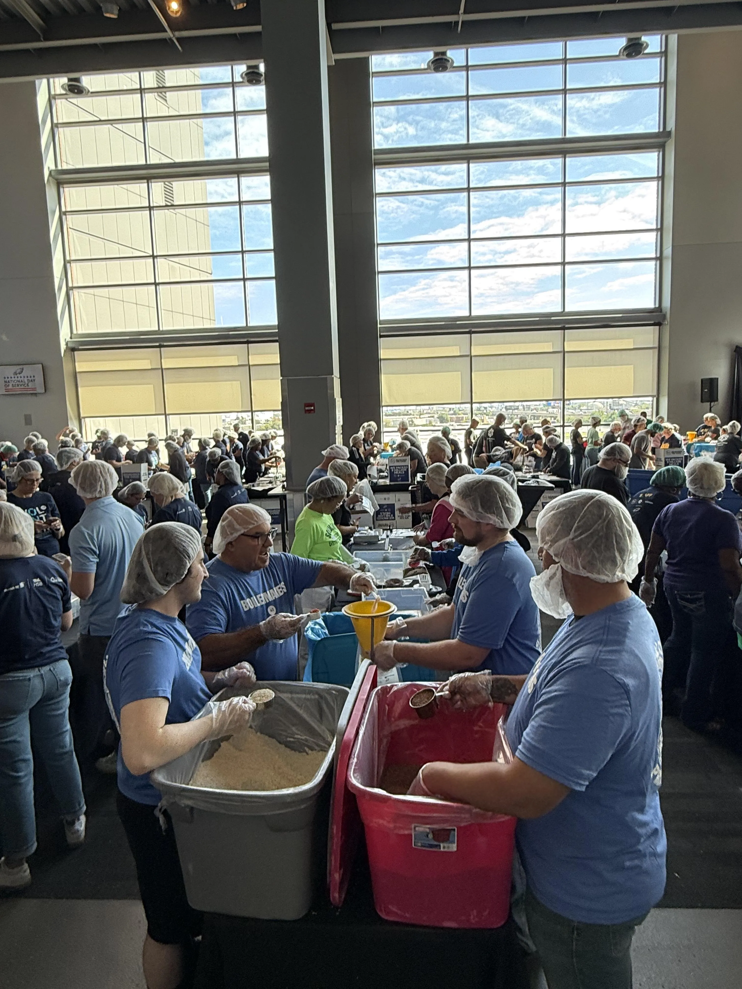 Union members packing meals together 