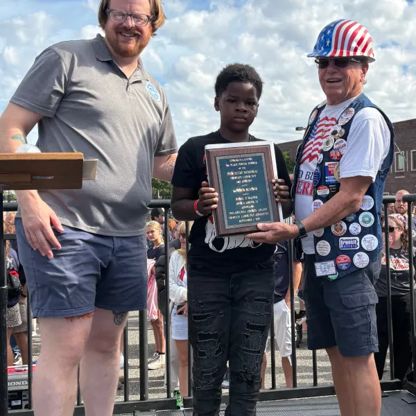 Student being awarded a plaque