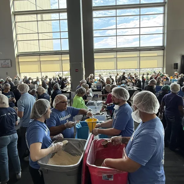 Union members packing meals together 